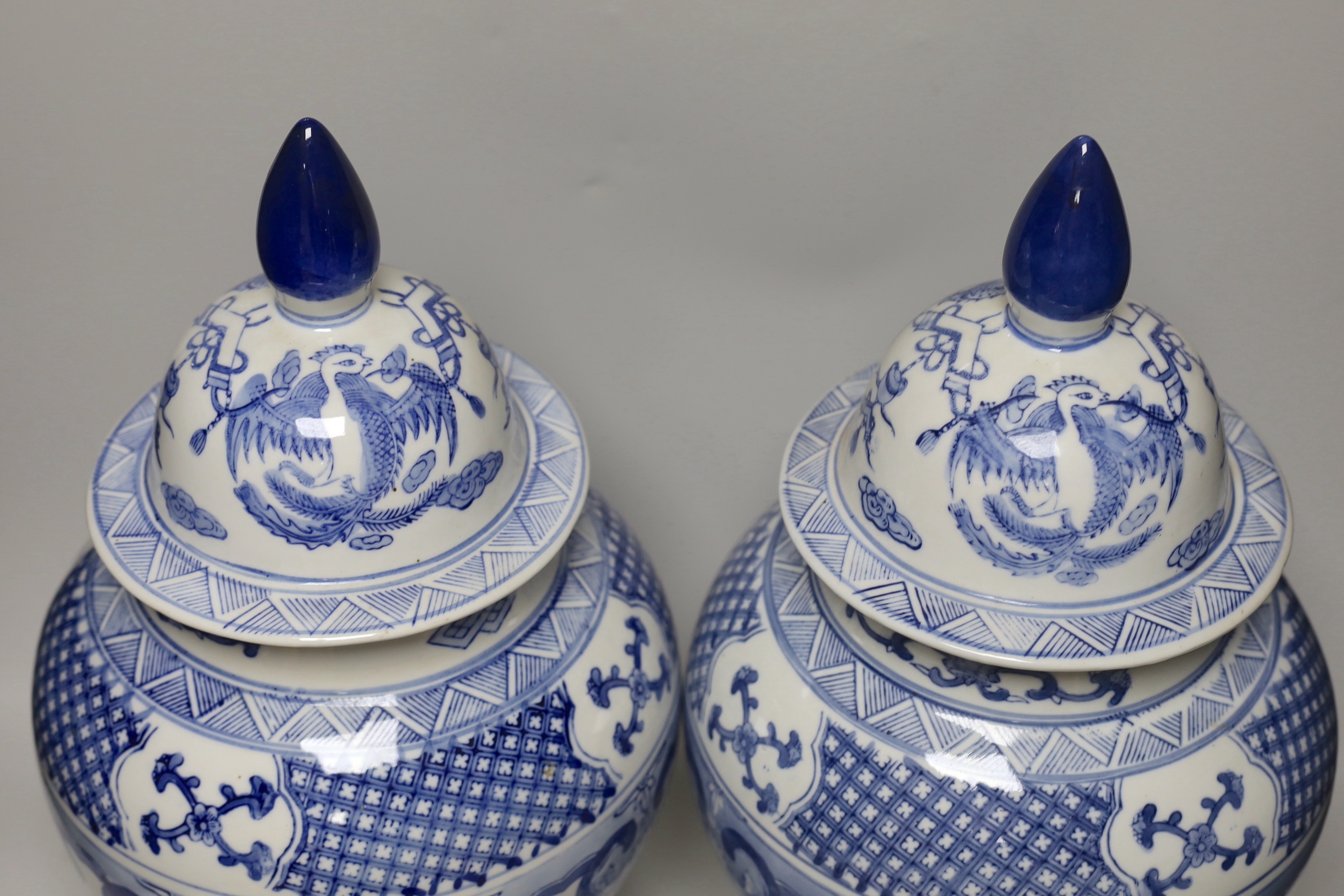 A pair of Chinese blue and white baluster vases and covers, 45cm high